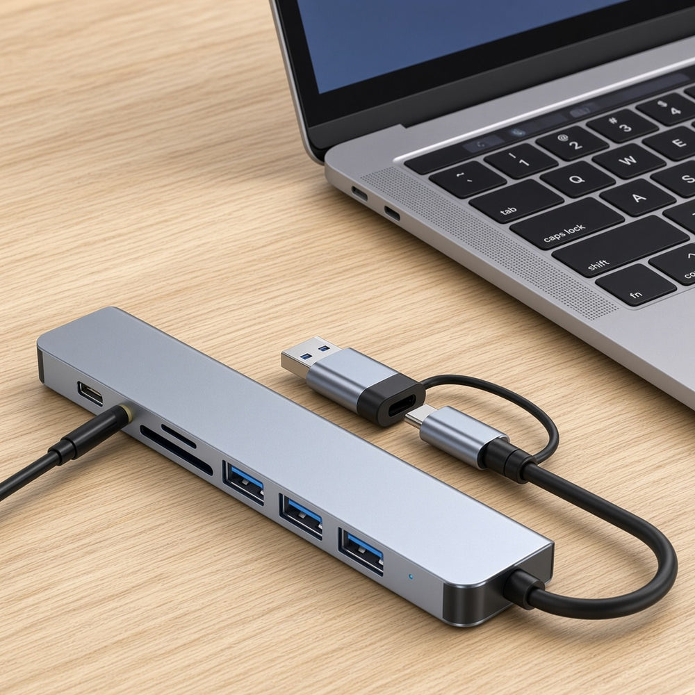 Dual-connector 8-in-1 USB hub on a desk next to a laptop