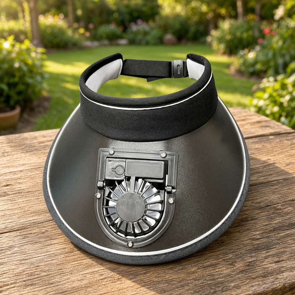 Black fan sun visor on a wooden table in a garden